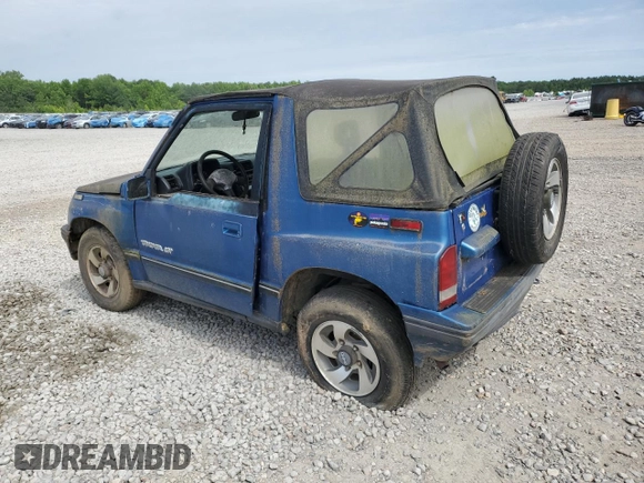 1993 Geo Tracker z VIN 2CNBJ18UXP6921660, wystawiony jako Copart lot #58027275 z przebiegiem 64 349 mil mil oraz Tytuł czysty. Historia ofert i sprzedaży dostępna na DreamBid. Obrazek 2.