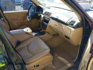 1998 Mercedes-Benz M-Class with VIN 4JGAB54EXWA030493, listed as a IAAI auction lot 41695224 with 249,325 mi miles. Bid and sale history available at carsss.com. Image 5.