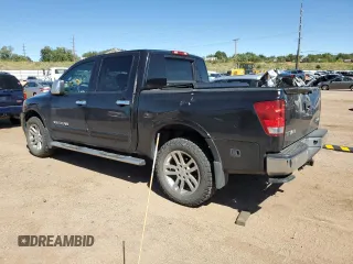 2014 Nissan Titan Pro-4X with VIN 1N6AA0EC2EN519983, listed as a Copart auction lot 71496934 with 150,259 mi miles and Salvage title. Bid and sale history available at DreamBid. Image 2.