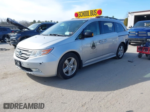 2012 Honda Odyssey Touring with VIN 5FNRL5H95CB063003, listed as a IAAI auction lot 41871975 with 179,332 mi miles and . Bid and sale history available at DreamBid. Image 17.