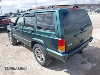 2000 Jeep Cherokee Classic with VIN 1J4FF58S3YL258755, listed as a IAAI auction lot 42020260 with 228,867 mi miles. Bid and sale history available at carsss.com. Image 3.