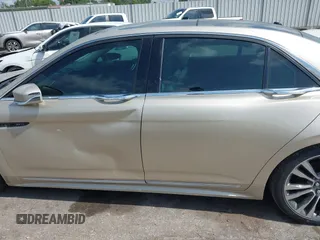 2017 Lincoln Continental Select z VIN 1LN6L9SK0H5631653, wystawiony jako IAAI lot #42092357 z przebiegiem Nie podano mil oraz . Historia ofert i sprzedaży dostępna na DreamBid. Obrazek 14.
