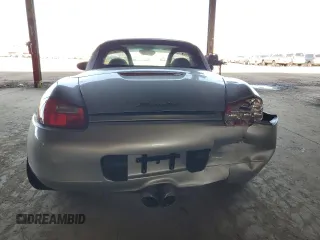 1997 Porsche Boxster с VIN WP0CA2984VS621039, выставлен на аукционе Copart как лот 60274455 с пробегом 59 619 миль миль и Списание • Salvage title. История ставок и продаж доступна на DreamBid. Изображение 6.