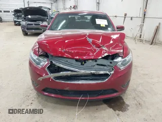 2015 Ford Taurus SEL z VIN 1FAHP2H88FG163179, wystawiony jako IAAI lot #42345579 z przebiegiem 142 424 mil mil oraz . Historia ofert i sprzedaży dostępna na DreamBid. Obrazek 12.