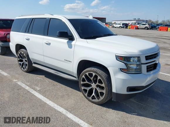 2015 Chevrolet Tahoe LT with VIN 1GNSCBKCXFR552071, listed as a IAAI auction lot 41972157 with 214,738 mi miles and . Bid and sale history available at DreamBid. Image 1.