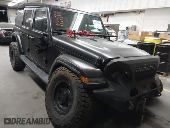 2018 Jeep Wrangler Unlimited Sahara z VIN 1C4HJXEN6JW294774, wystawiony jako IAAI lot #41573606 z przebiegiem 49 325 mil mil oraz . Historia ofert i sprzedaży dostępna na DreamBid. Obrazek 1.