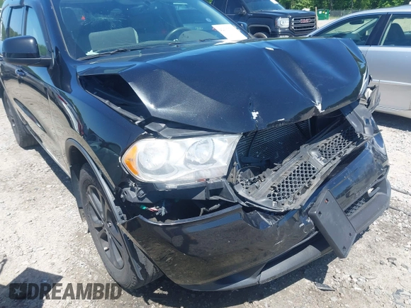 2013 Dodge Durango SXT with VIN 1C4RDJAG8DC617759, listed as a IAAI auction lot 42113300 with 185,152 mi miles and . Bid and sale history available at DreamBid. Image 17.