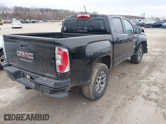 2021 GMC Canyon 4WD AT4 w/Leather with VIN 1GTG6FEN4M1103068, listed as a IAAI auction lot 41673275 with 62,254 mi miles. Bid and sale history available at carsss.com. Image 4.