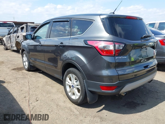 2017 Ford Escape SE z VIN 1FMCU0GD9HUD28110, wystawiony jako IAAI lot #41903505 z przebiegiem 66 808 mil mil oraz . Historia ofert i sprzedaży dostępna na DreamBid. Obrazek 3.