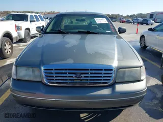 2002 Ford Crown Victoria Police Pkg Police Interceptor with VIN 2FAFP71W52X143053, listed as a IAAI auction lot 41594827 with 210,078 mi miles. Bid and sale history available at carsss.com. Image 12.