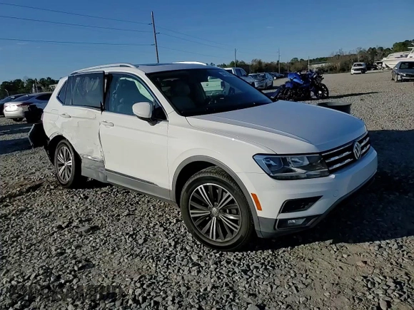 2018 Volkswagen Tiguan SEL z VIN 3VV3B7AX3JM047891, wystawiony jako Copart lot #41615545 z przebiegiem 63 995 mil mil oraz Szkoda całkowita • Salvage title. Historia ofert i sprzedaży dostępna na DreamBid. Obrazek 11.