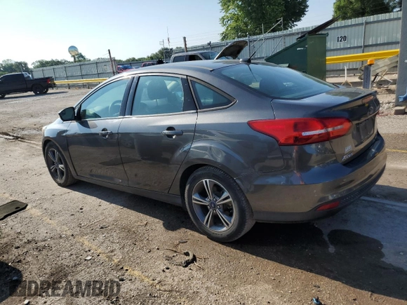 2016 Ford Focus SE with VIN 1FADP3FE1GL253425, listed as a Copart auction lot 64285965 with 105,309 mi miles and Salvage title. Bid and sale history available at DreamBid. Image 2.