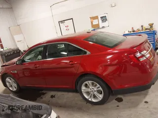 2014 Ford Taurus SEL z VIN 1FAHP2E83EG137639, wystawiony jako IAAI lot #41535259 z przebiegiem 62 978 mil mil oraz . Historia ofert i sprzedaży dostępna na DreamBid. Obrazek 14.