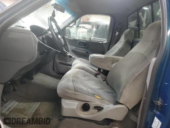 1999 Ford F-150 z VIN 1FTRF17W6XNB72620, wystawiony jako Copart lot #50977015 z przebiegiem Nie podano mil oraz Szkoda całkowita • Salvage title. Historia ofert i sprzedaży dostępna na DreamBid. Obrazek 7.