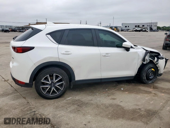 2018 Mazda CX-5 Touring z VIN JM3KFACM0J0469433, wystawiony jako Copart lot #54349955 z przebiegiem Nie podano mil oraz Szkoda całkowita • Salvage title. Historia ofert i sprzedaży dostępna na DreamBid. Obrazek 3.