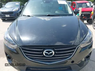 2016 Mazda CX-5 Grand Touring z VIN JM3KE2DY2G0765444, wystawiony jako IAAI lot #42527577 z przebiegiem 162 871 mil mil oraz . Historia ofert i sprzedaży dostępna na DreamBid. Obrazek 12.