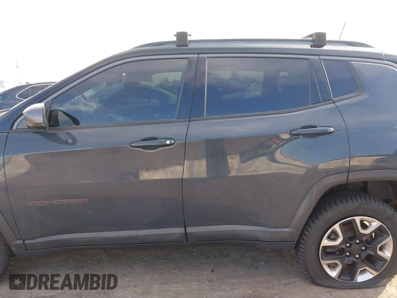 2017 Jeep Compass Trailhawk with VIN 3C4NJDDBXHT657425, listed as a IAAI auction lot 41022289 with 83,003 mi miles and . Bid and sale history available at DreamBid. Image 14.