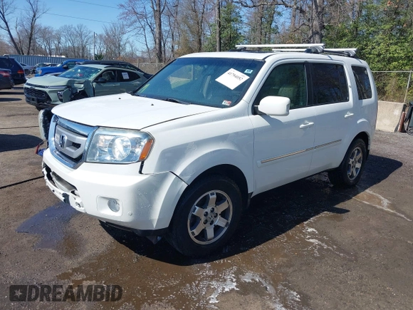 2011 Honda Pilot Touring with VIN 5FNYF4H96BB014095, listed as a IAAI auction lot 41794052 with 202,440 mi miles and . Bid and sale history available at DreamBid. Image 17.