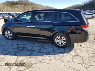 2014 Honda Odyssey EX-L with VIN 5FNRL5H69EB121140, listed as a Copart auction lot 79698724 with 169,626 mi miles and Salvage Title. Bid and sale history available at DreamBid. Image 2.