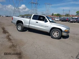 2001 Dodge Dakota SLT with VIN 1B7GG22XX1S348751, listed as a IAAI auction lot 42077395 with 148,034 mi miles and . Bid and sale history available at carsss.com. Image 1.