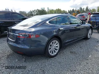 2017 Tesla Model S 100D with VIN 5YJSA1E27HF202563, listed as a IAAI auction lot 42460702 with 71,715 mi miles and . Bid and sale history available at DreamBid. Image 4.