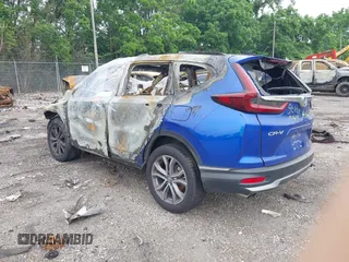 2021 Honda CR-V Touring with VIN 7FARW2H98ME008086, listed as a IAAI auction lot 42411519 with Not provided miles and . Bid and sale history available at DreamBid. Image 3.