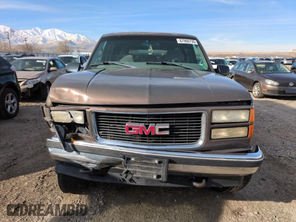 1998 GMC Suburban z VIN 3GKFK16R4WG507685, wystawiony jako Copart lot #87900735 z przebiegiem 183 033 mil mil oraz Szkoda całkowita • Salvage title. Historia ofert i sprzedaży dostępna na DreamBid. Obrazek 5.
