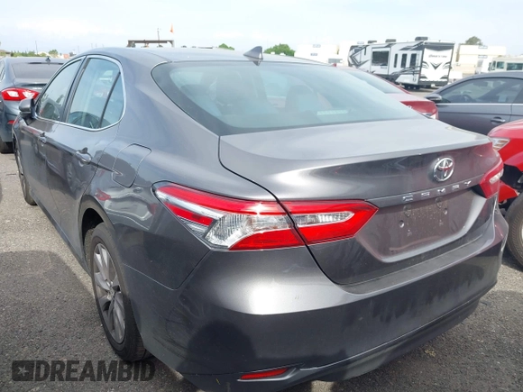 2019 Toyota Camry LE with VIN 4T1B11HK4KU254853, listed as a IAAI auction lot 42013255 with 153,664 mi miles and . Bid and sale history available at DreamBid. Image 3.