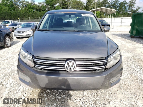 2014 Volkswagen Tiguan S z VIN WVGBV3AX2EW519798, wystawiony jako Copart lot #60316895 z przebiegiem 182 002 mil mil oraz Czysty tytuł • Clean title. Historia ofert i sprzedaży dostępna na DreamBid. Obrazek 5.
