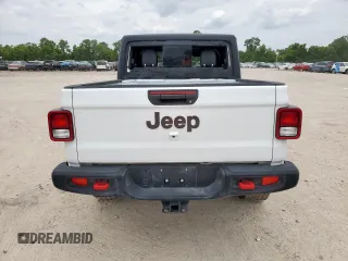 2023 Jeep Gladiator Rubicon with VIN 1C6JJTBG8PL532271, listed as a Copart auction lot 58220565 with 34,172 mi miles and Salvage title. Bid and sale history available at DreamBid. Image 6.