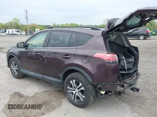 2018 Toyota RAV4 LE with VIN 2T3BFREV9JW771845, listed as a IAAI auction lot 42108641 with 127,394 mi miles. Bid and sale history available at carsss.com. Image 3.