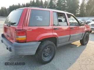 1996 Jeep Grand Cherokee z VIN 1J4EZ58Y5TC142263, wystawiony jako Copart lot #70532894 z przebiegiem Nie podano mil oraz Szkoda całkowita • Salvage title. Historia ofert i sprzedaży dostępna na DreamBid. Obrazek 3.