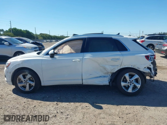 2021 Audi Q3 Premium with VIN WA1AUCF32M1097059, listed as a IAAI auction lot 41825132 with 66,144 mi miles and . Bid and sale history available at DreamBid. Image 14.