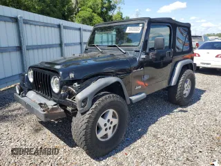 2002 Jeep Wrangler Sport z VIN 1J4FA49S72P700833, wystawiony jako Copart lot #56938885 z przebiegiem 126 362 mil mil oraz Szkoda całkowita • Salvage title. Historia ofert i sprzedaży dostępna na DreamBid. Obrazek 1.