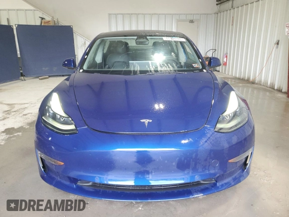 2022 Tesla Model 3 with VIN 5YJ3E1EA7NF369551, listed as a Copart auction lot 55610805 with 128,311 mi miles and Clean Title. Bid and sale history available at DreamBid. Image 5.