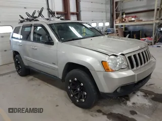 2010 Jeep Grand Cherokee Laredo with VIN 1J4PR4GK9AC160097, listed as a IAAI auction lot 41883264 with 240,409 mi miles. Bid and sale history available at carsss.com. Image 1.