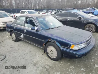 1989 Toyota Camry z VIN 4T1SV22E0KU032677, wystawiony jako Copart lot #46308555 z przebiegiem 993 896 mil mil oraz Czysty tytuł • Clean title. Historia ofert i sprzedaży dostępna na DreamBid. Obrazek 4.