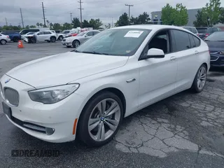 2011 BMW 5 Series GT 550i with VIN WBASN4C59BC210040, listed as a IAAI auction lot 42140088 with 130,771 mi miles. Bid and sale history available at carsss.com. Image 2.