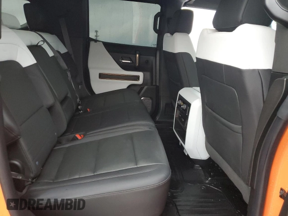 2024 GMC Hummer EV 3X z VIN 1GKB0RDC6RU107095, wystawiony jako Copart lot #82655324 z przebiegiem 6013 mil mil oraz Szkody całkowita. Historia ofert i sprzedaży dostępna na DreamBid. Obrazek 11.