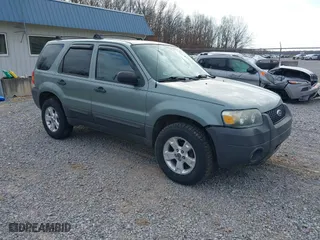 2007 Ford Escape XLT with VIN 1FMYU03107KA50631, listed as a IAAI auction lot 41374784 with 174,870 mi miles. Bid and sale history available at carsss.com. Image 1.