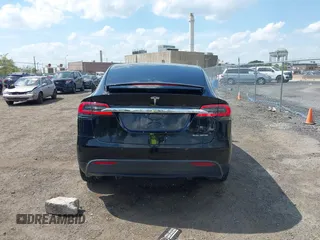 2019 Tesla Model X 75D with VIN 5YJXCBE21KF180203, listed as a IAAI auction lot 42190255 with 114,294 mi miles and . Bid and sale history available at carsss.com. Image 16.