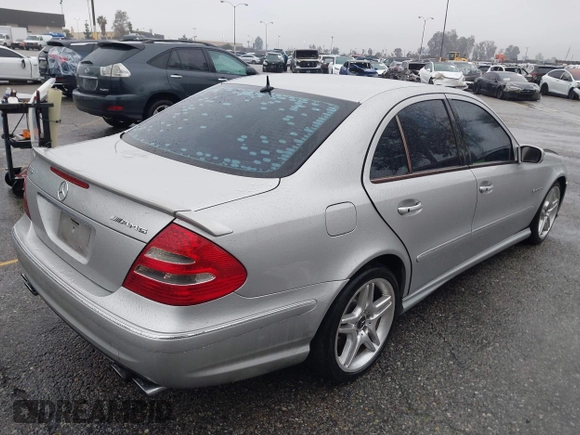 2003 Mercedes-Benz E-Class 5.5L AMG with VIN WDBUF76J93A351317, listed as a IAAI auction lot 41573446 with 144,119 mi miles. Bid and sale history available at carsss.com. Image 4.