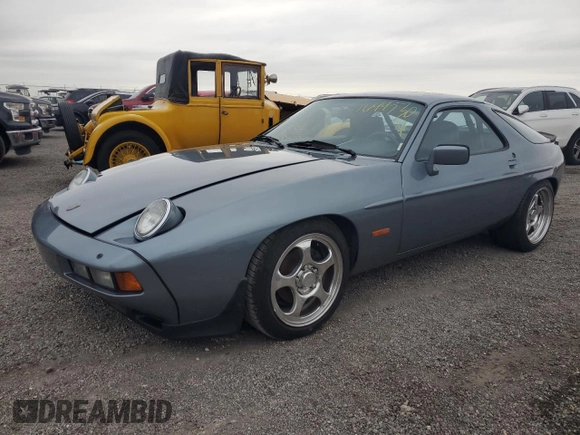 1983 Porsche 928 z VIN WP0ZZZ92ZDS841622, wystawiony jako Copart lot #76995304 z przebiegiem 83 862 mil mil oraz Szkody całkowita. Historia ofert i sprzedaży dostępna na DreamBid. Obrazek 1.