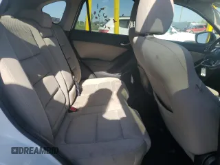 2016 Mazda CX-5 Touring z VIN JM3KE2CYXG0683673, wystawiony jako Copart lot #56724025 z przebiegiem 107 293 mil mil oraz Szkoda całkowita • Salvage title. Historia ofert i sprzedaży dostępna na DreamBid. Obrazek 11.