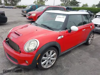 2009 MINI Cooper Hardtop S with VIN WMWMF73549TW87458, listed as a IAAI auction lot 42051759 with 135,309 mi miles. Bid and sale history available at carsss.com. Image 2.