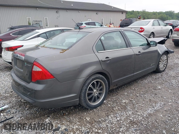 2011 Ford Fusion Hybrid with VIN 3FADP0L39BR345250, listed as a IAAI auction lot 42319401 with 321,317 mi miles and . Bid and sale history available at DreamBid. Image 4.