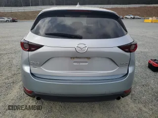 2021 Mazda CX-5 Touring with VIN JM3KFACM2M0451083, listed as a Copart auction lot 49999935 with 59,927 mi miles and Salvage Title. Bid and sale history available at carsss.com. Image 6.