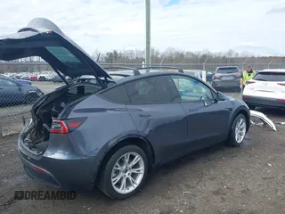 2023 Tesla Model Y Long Range with VIN 7SAYGDEE8PF599254, listed as a IAAI auction lot 41718342 with 24,339 mi miles and . Bid and sale history available at carsss.com. Image 4.