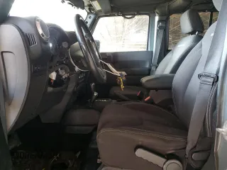 2014 Jeep Wrangler Unlimited Rubicon with VIN 1C4BJWFG4EL141706, listed as a Copart auction lot 51305235 with 106,919 mi miles and Salvage Title. Bid and sale history available at carsss.com. Image 7.