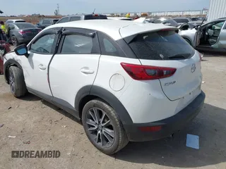 2018 Mazda CX-3 Touring z VIN JM1DKDC75J0326180, wystawiony jako IAAI lot #41787541 z przebiegiem 96 584 mil mil oraz . Historia ofert i sprzedaży dostępna na DreamBid. Obrazek 3.